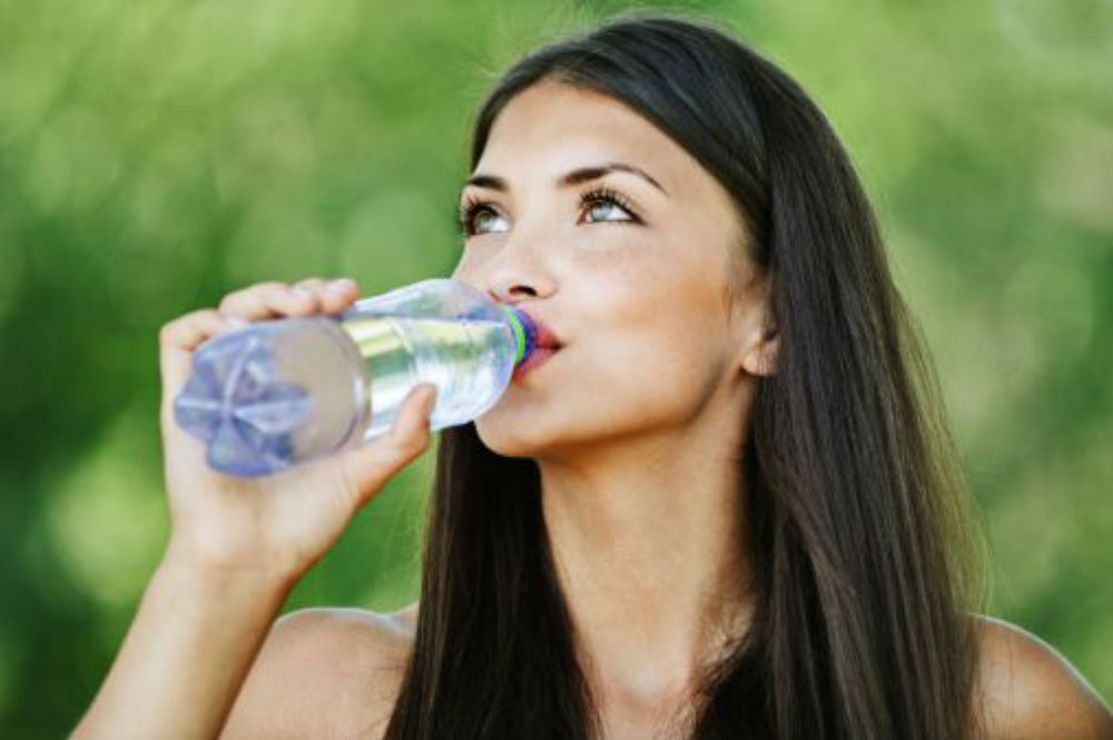 portrait-pretty-young-woman-drinking-water-_tg3y