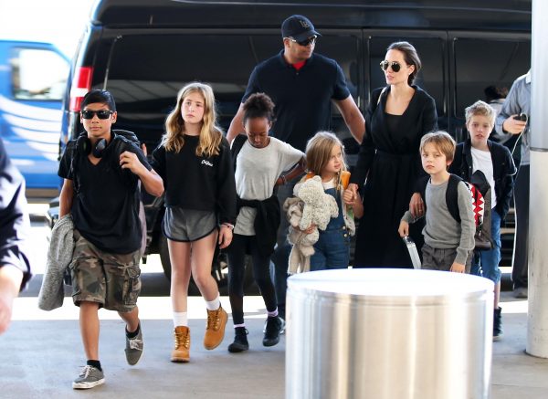 Actress and busy mom Angelina Jolie departing on a flight at LAX with her children at LAX.