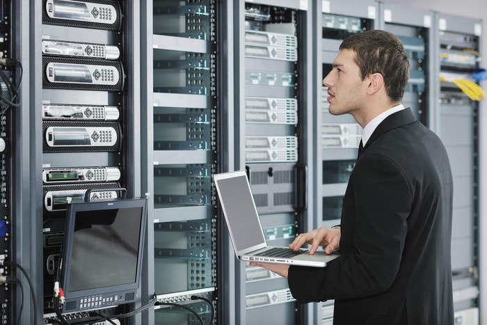 Engineer Working On Network Servers