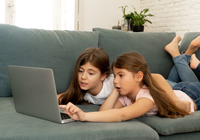 Sisters Playing on Computer with Parental Control